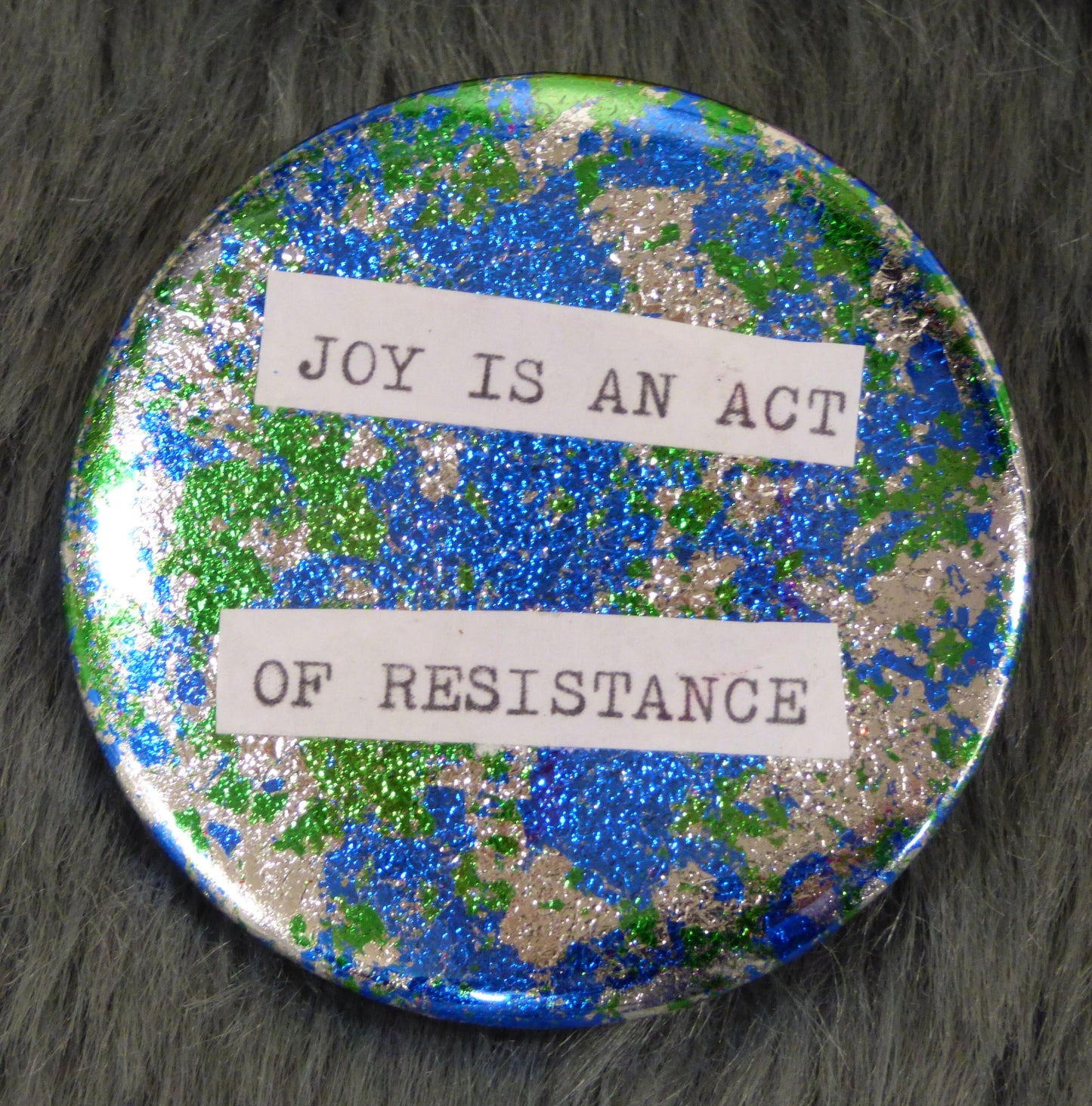 Joy is an act of resistance metal leaf gilded 2.25" pin back button