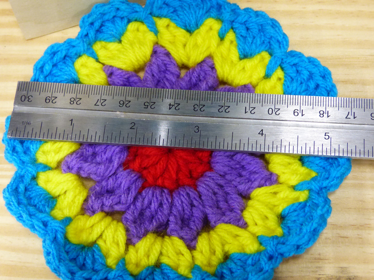 Hand Crocheted Coasters Four Piece Set Blue, Yellow, Purple, and Red