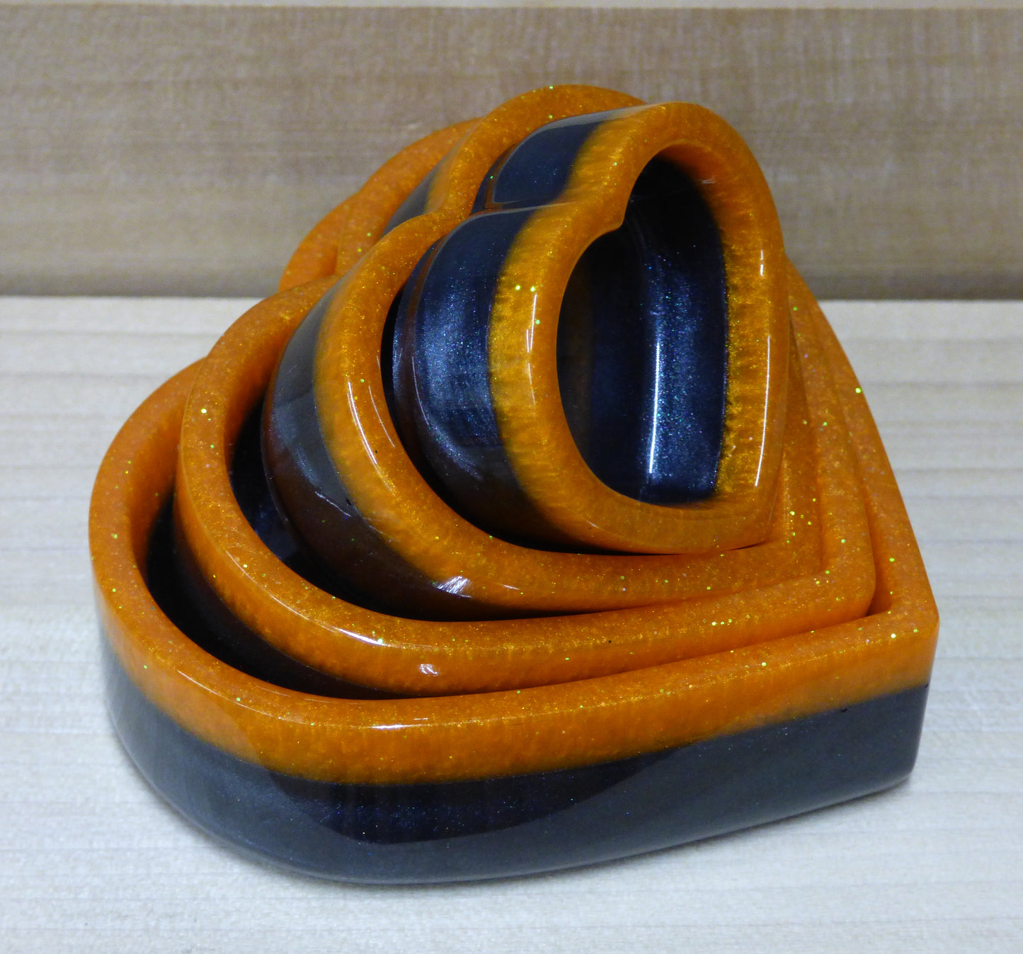 Set of four resin silver black and orange heart shaped dishes