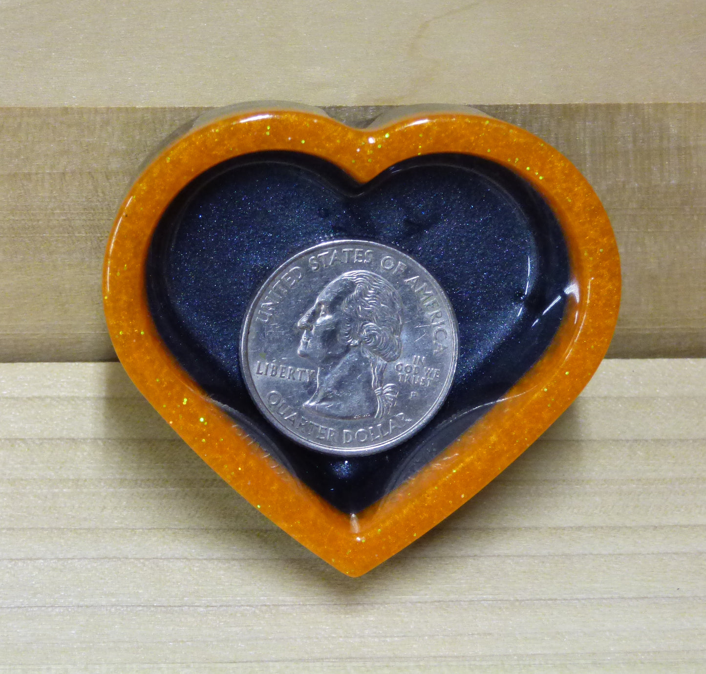 Set of four resin silver black and orange heart shaped dishes 