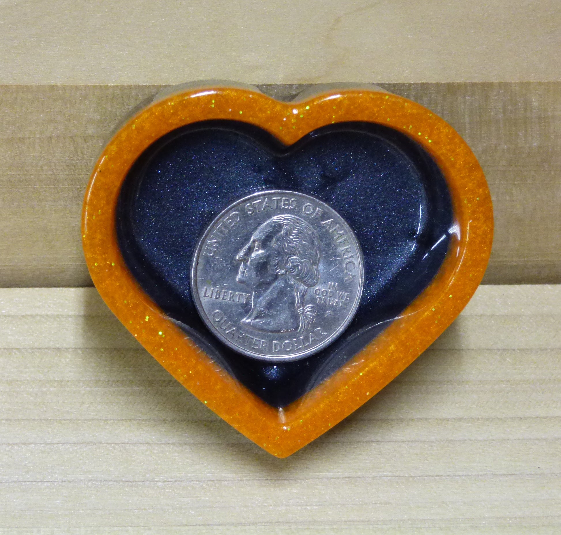 Set of four resin silver black and orange heart shaped dishes 