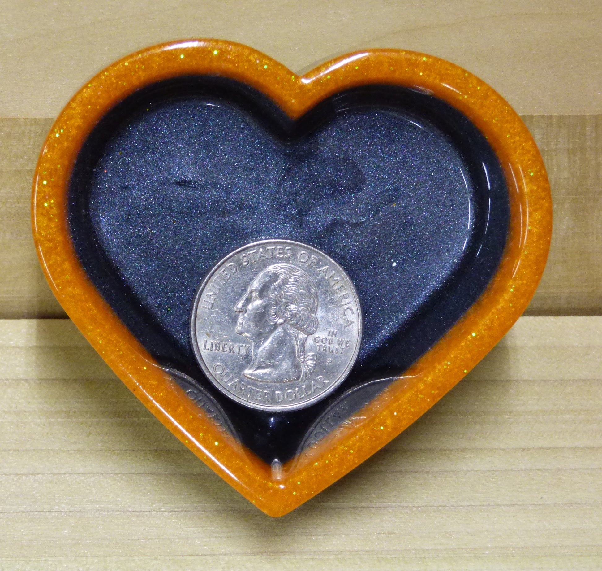 Set of four resin silver black and orange heart shaped dishes 