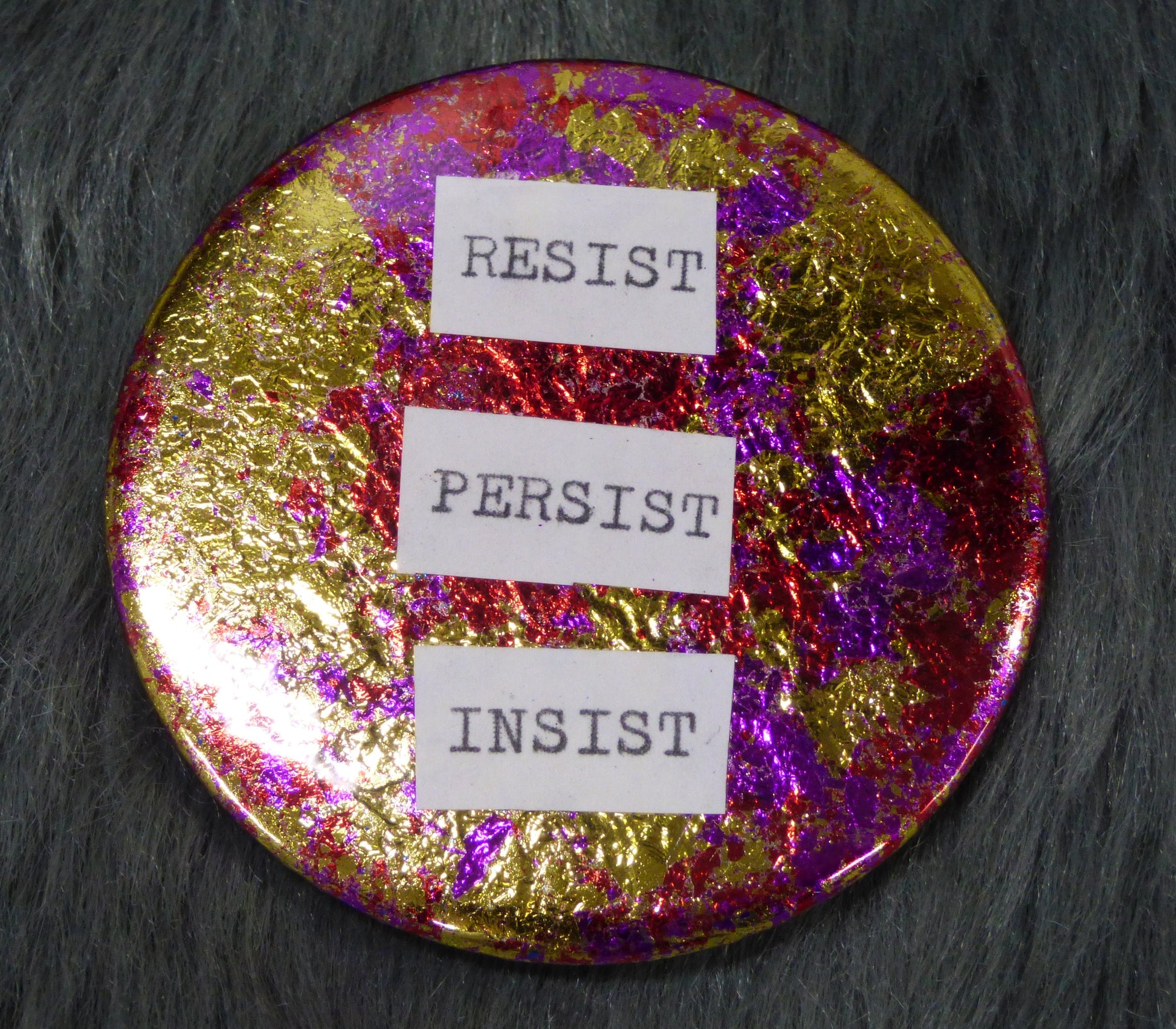 Resists Persist Insist metal leaf gilded 2.25" pin back button